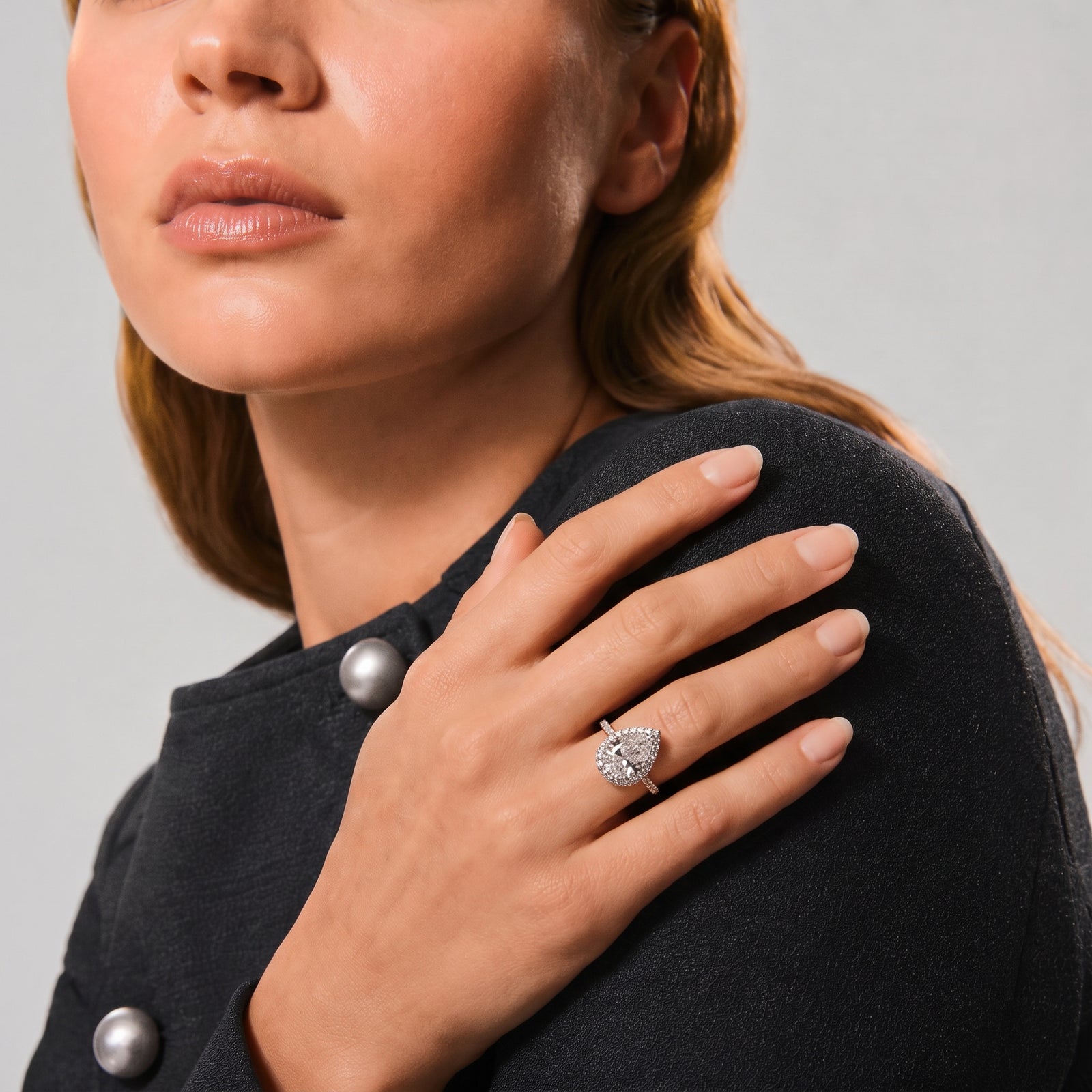 Pear Moissanite Halo Twist Pavé Ring