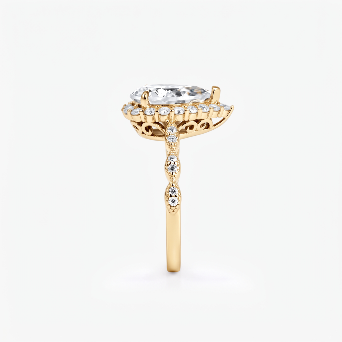 Pear Moissanite Halo Twist Pavé Ring