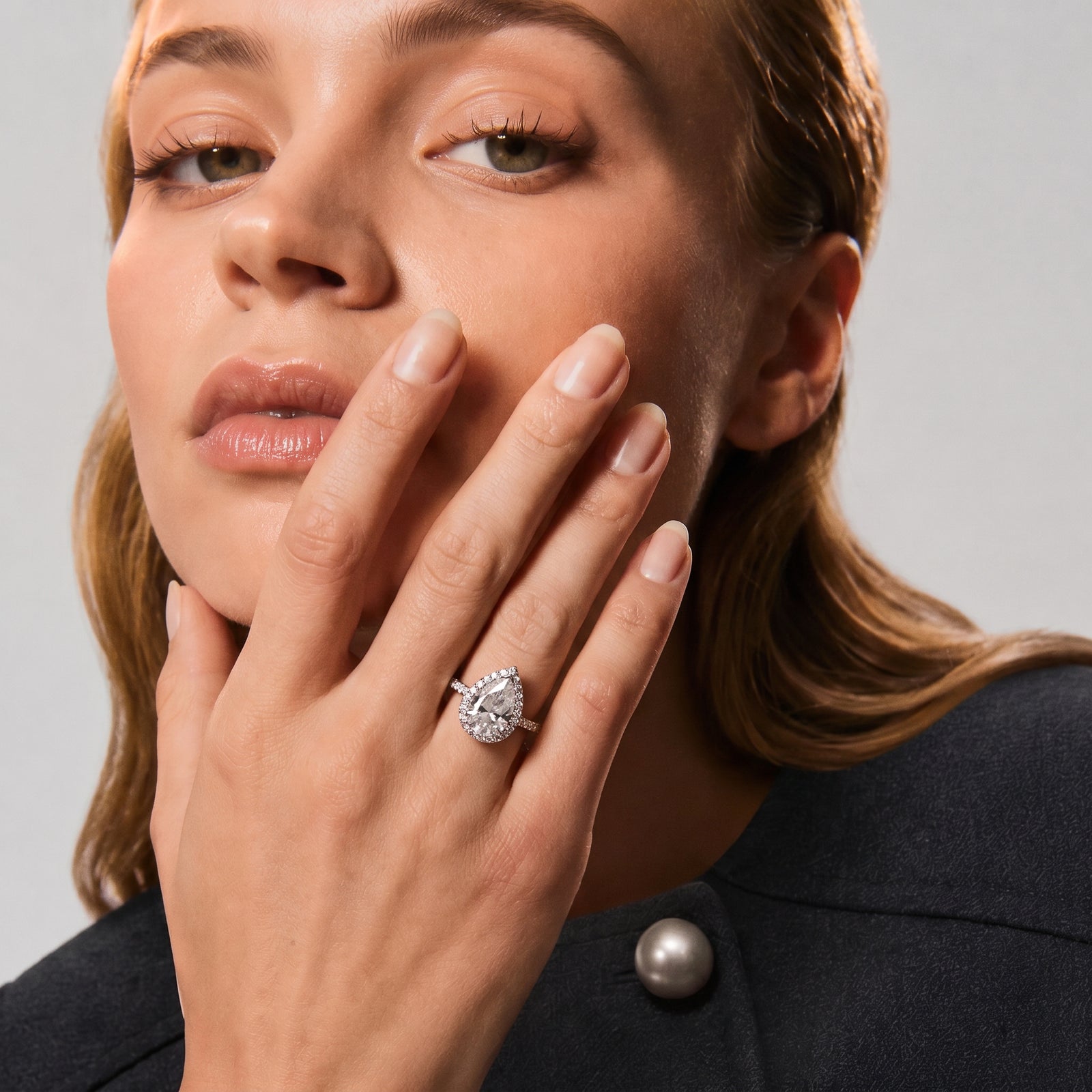 Pear Moissanite Halo Twist Pavé Ring