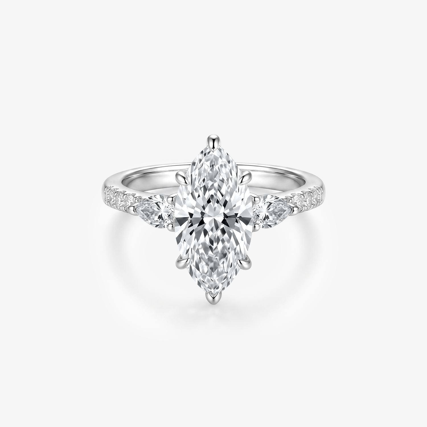A silver-toned moissanote ring featuring a large marquise-cut center stone with smaller moissanote along the shoulders, set against a clean white background.