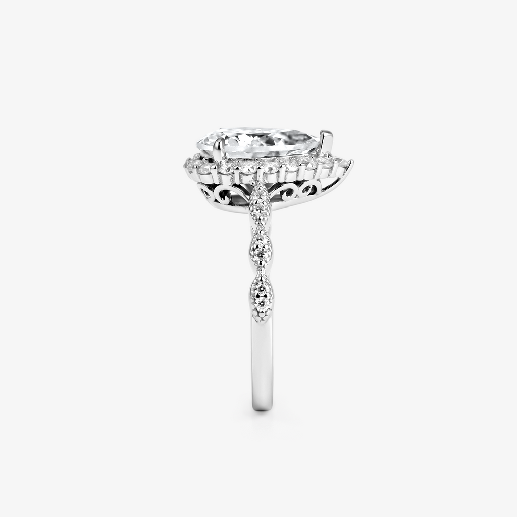 Pear Moissanite Halo Twist Pavé Ring